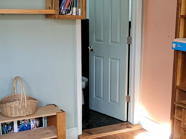 Second floor bedroom with custom shelves designed for school work or home office