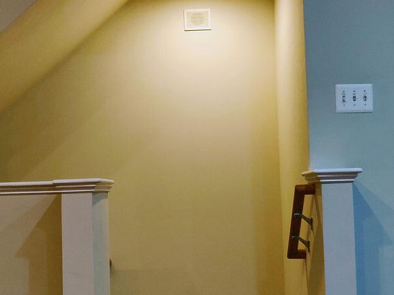 Entry from stairs to living and kitchen