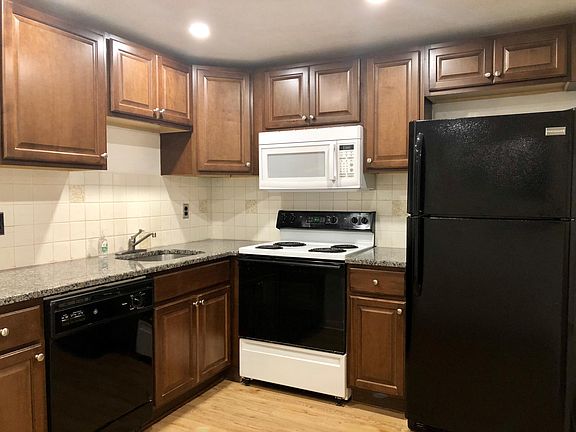 Updated kitchen with Granite countertop and cognac cabinets