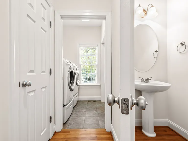 Laundry room, storage and half bath