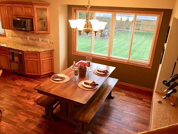 Informal dining room space that fits a nice size farm table.    Check out the view of the backyard and firepit area.