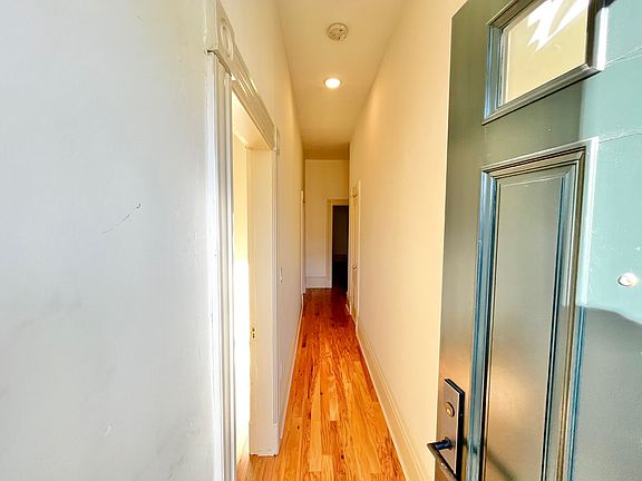 Immediately upon entry through the custom-made doors, the hardwood floors welcome you in with a glowing charm