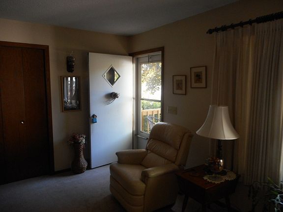 Front entry into living room with coat closet