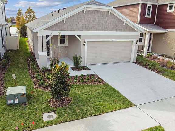 Flora new construction quick move-in elevated left angled view at BridgeWater Lakeland, FL by Willia