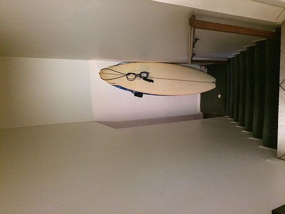 Stairs leading to laundry room and garage