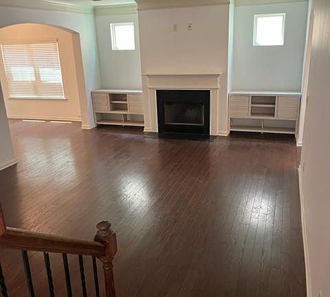 Open LIVING ROOM with built in cabinets