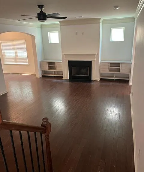 Open LIVING ROOM with built in cabinets