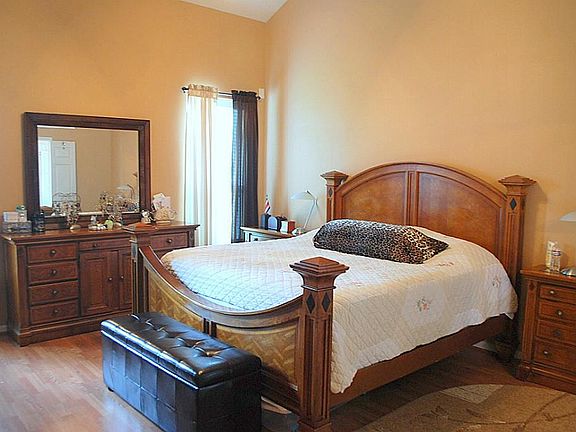 Large downstairs master bedroom with laminate flooring!