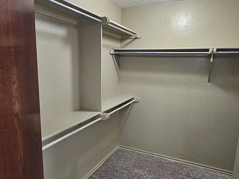 Left side entry into walk through master closet