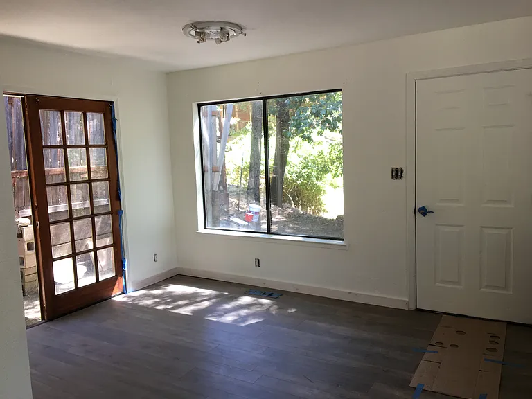 Looking south towards the east set of French doors and the south door