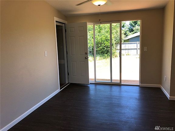 Large dining area with slider to new deck.  Garage is to the left.