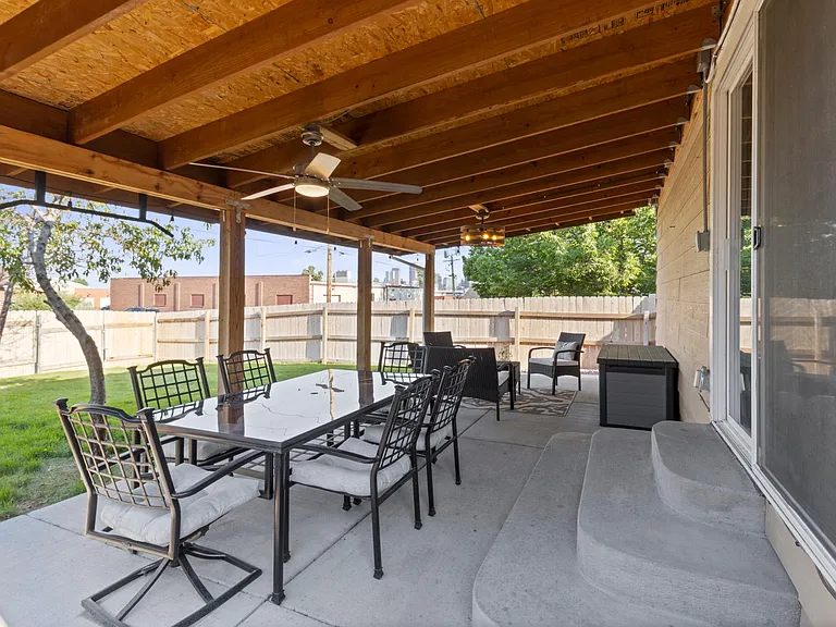 Backyard + patio with lighting and fans