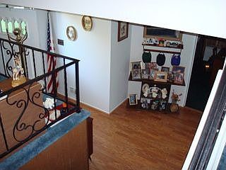 Enter in the foyer with recently installed wood laminate flooring