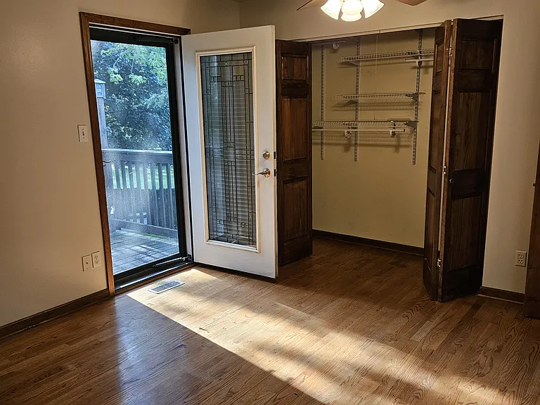 Master Bedroom w/ Balcony, screen door, closet organizer shelves, dimmable ceiling lights and ceiling fan