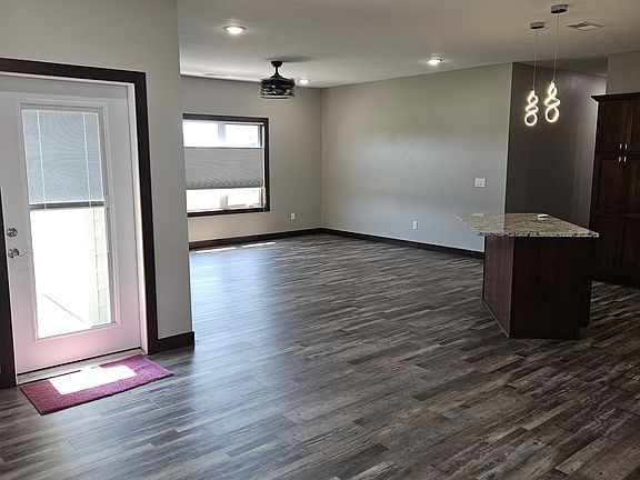 Door to back patio with privacy shade in door, living room