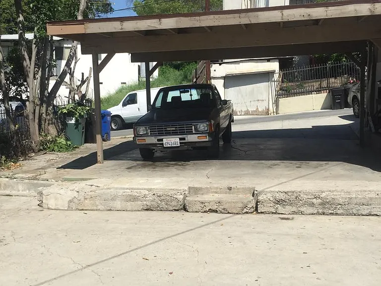 Two parking spaces in carport that are assigned to home