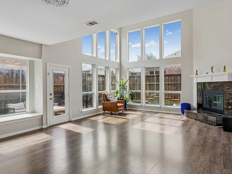 Family room with views of sideyard and pool.