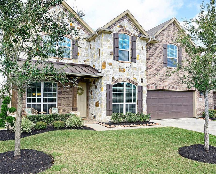 Beautiful curb appeal greets you at 13226 Edison Trace Ln. Tomball TX.