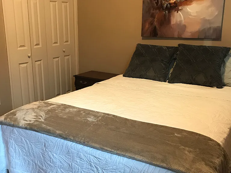 Bedroom showing closet. Picture shows a queen size bed (not included) for example only