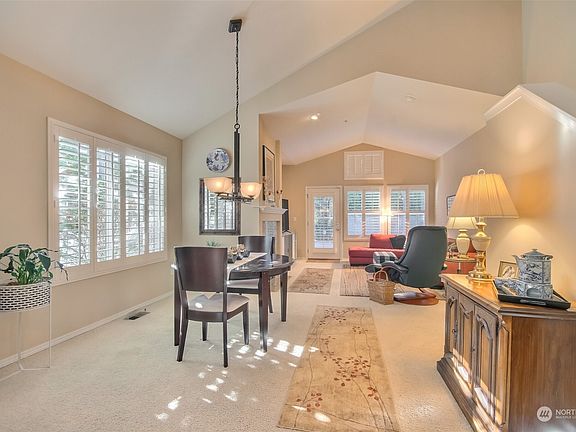 Amazing floorplan with spacious dining room w/ vaulted ceilings open to the large living room. Kitchen just thru the doorway>