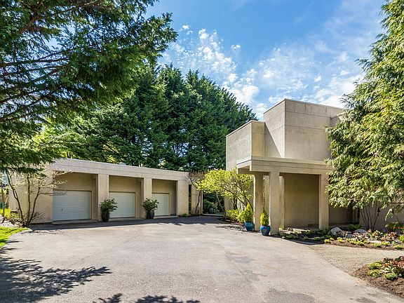 The front entrance of the home is accessed from Baker Hill Road.