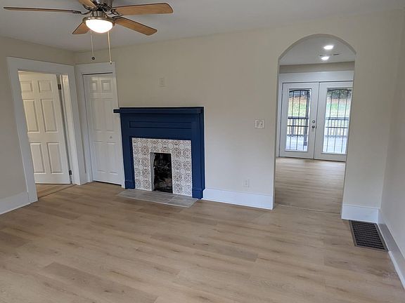 Living Room with Decorative Tiled Fireplace