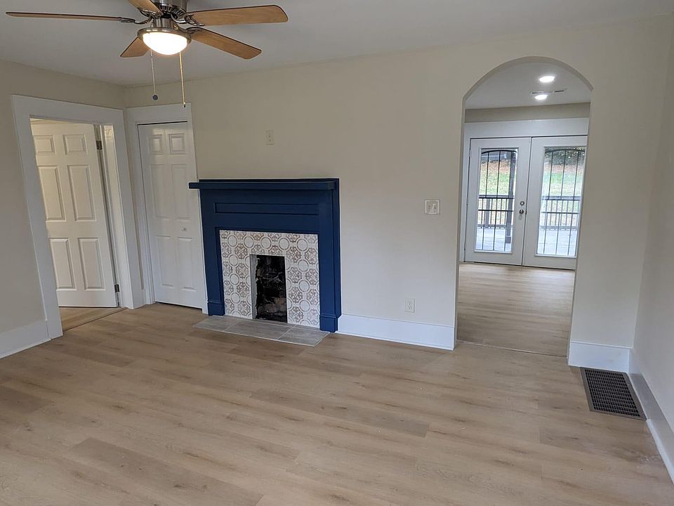Living Room with Decorative Tiled Fireplace