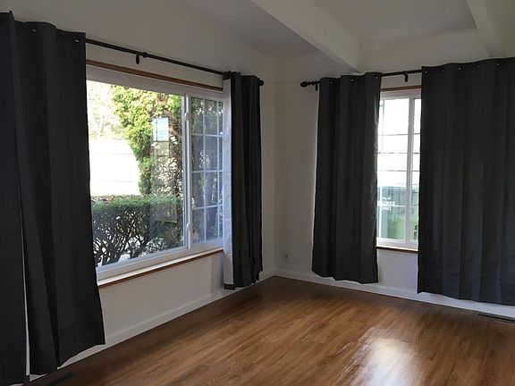Bright living room, tall ceilings, large closets