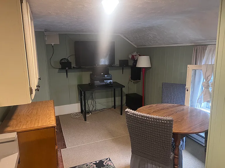 Rec/dining area with large TV and stereo