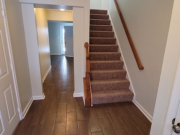 foyer leading to lower level finished space/ stairs to main level