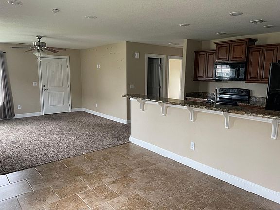 VIEW OF KITCHEN, LR, & HALLWAY