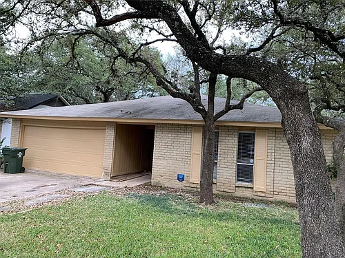 10015 NW Woodland Village Dr Photo 1