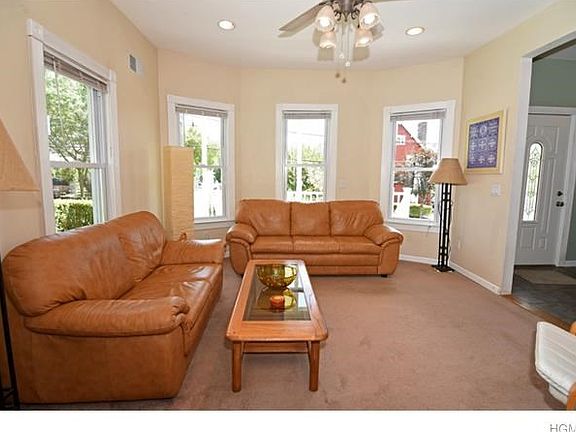 Sun filled living room looks out to front porch.