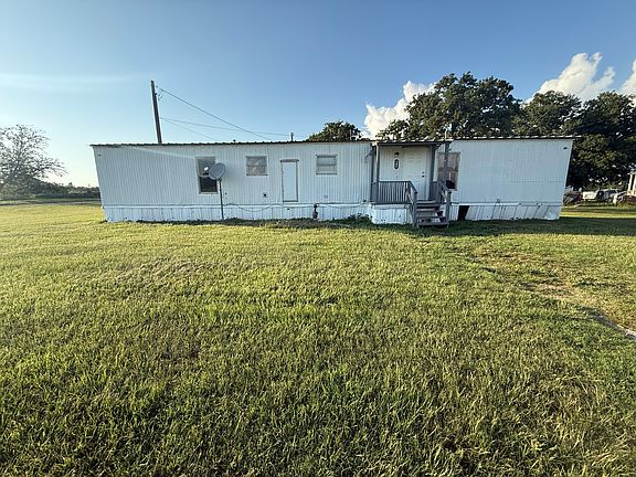 Closer view of home. We are working on replacing all the vinyl panels.