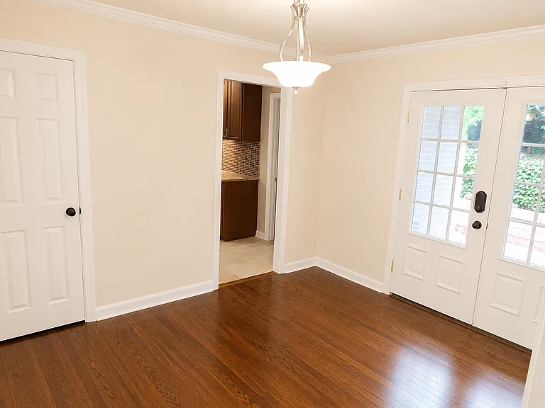 3rd Bedroom - Used as Dining/Office Room - Edited with AI to remove personal items and furniture.