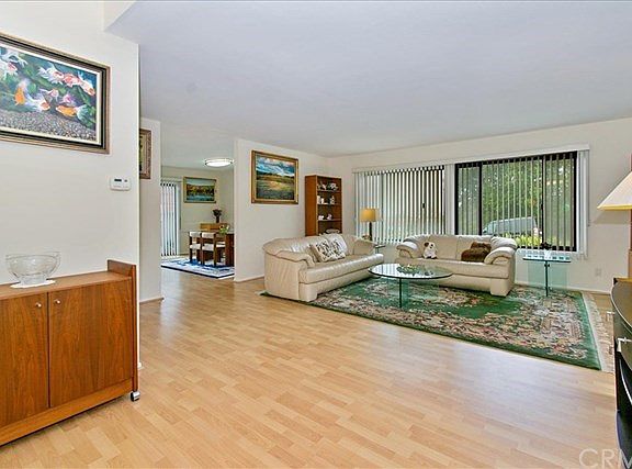 Bright Open floor plan showing entry, living room and dining room