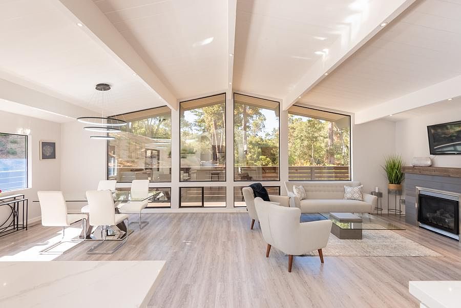 Large windows bring natural light and woodland beauty indoors