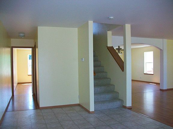 View of stairs and living room from eating area off the kitchen