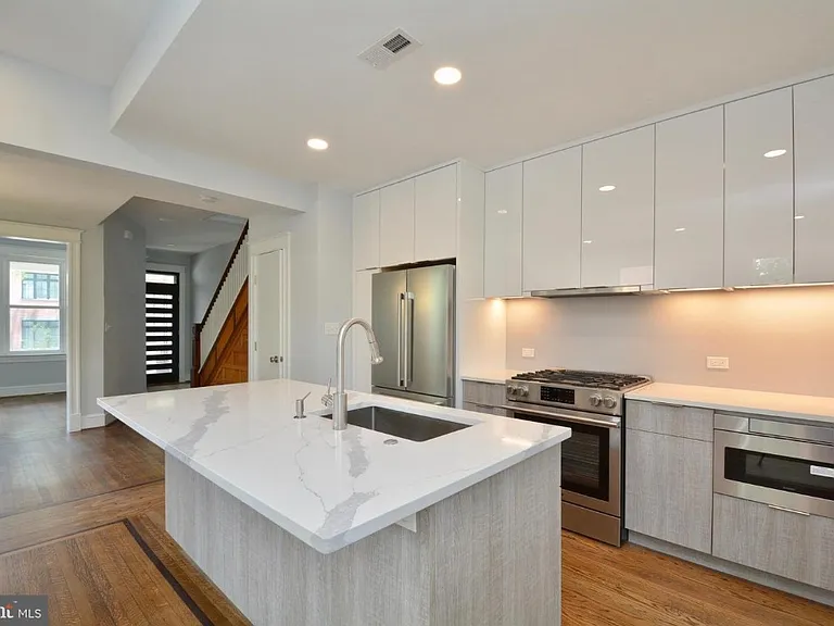Updated, Stylish Kitchen with Quartz Counters and Gas Cooking
