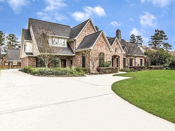 Fully fenced with electronic gate. Front parking pad with walkway to secondary front door that leads to hallway where utility, MUD, and Double area Pantry is.