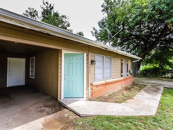 Paved sidewalk and covered car port