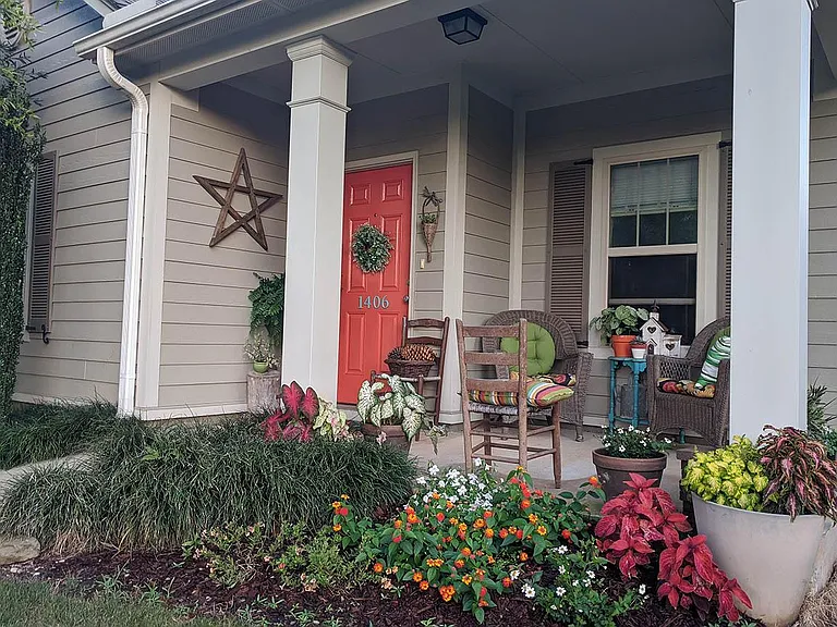Front porch - back porch is similar - lawn and pest service provided. House faces north. Off street parking for three cars. Rear alley access. Wooden privacy fence