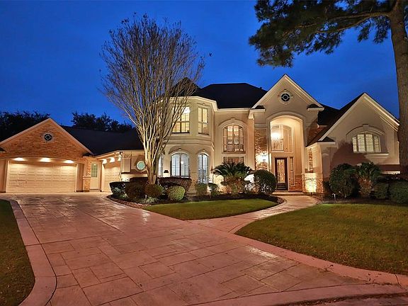 SITUATED ON A CORNER LOT WITH A BEAUTIFUL LAKE DIRECTLY ACROSS THE STREET - At an all stucco and stone exterior, this home exudes beauty and warmth. The recreational amenities are plenty and include a massive pool and spa with rock cave features, sum