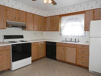 Kitchen offers lots of cabinets plus dishwasher, electric range & refrigerator