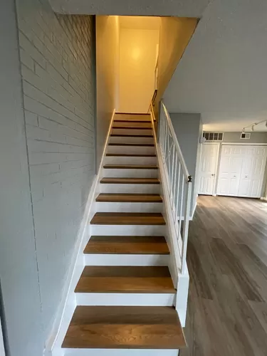 Stairway to bedrooms and bath. - 1142 S Mason Rd