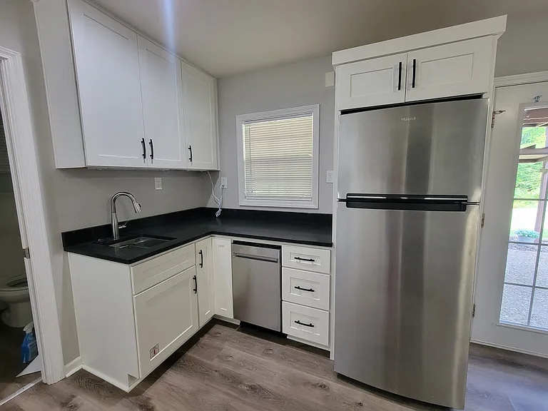 Kitchenette with dishwasher and disposal