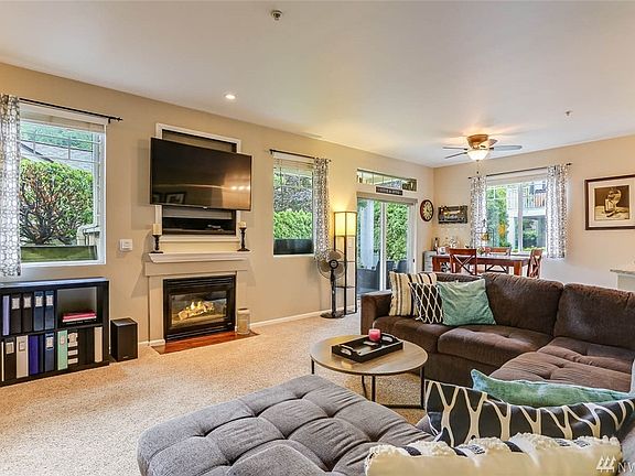 Enjoy relaxing in the open living room with a cozy gas fireplace. 