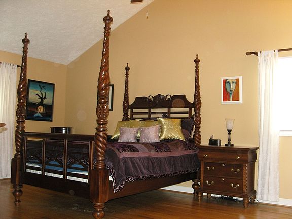 master bedroom with vaulted ceilings