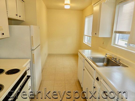Kitchen has room for table and chairs in the back