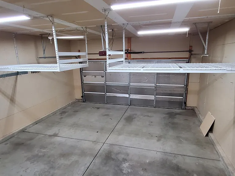 Garage, with overhead storage racks, remote door openers